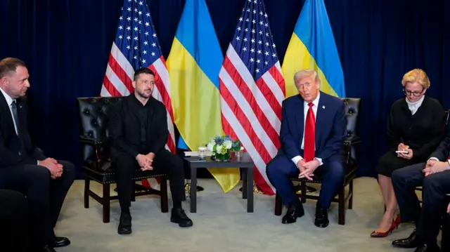 A wide shot of Zelensky and Trump at a bilateral meeting