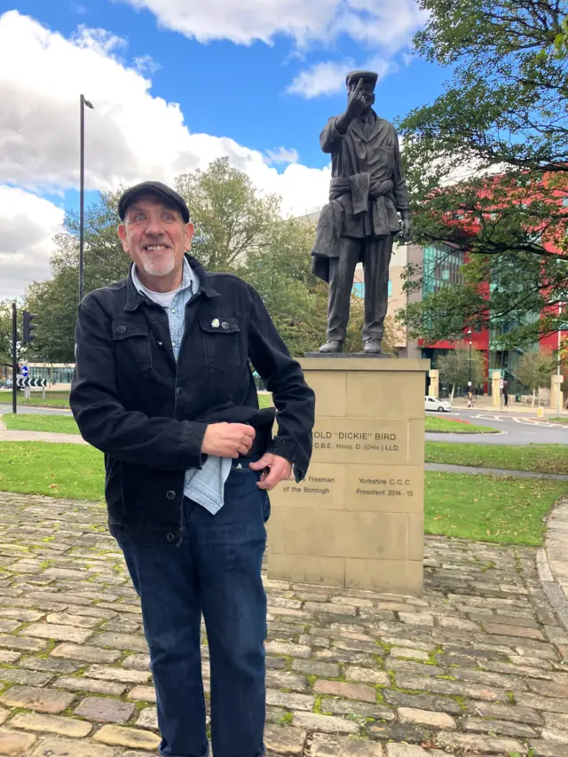 Sculptor Graham Ibberson at the statue in Barnsley