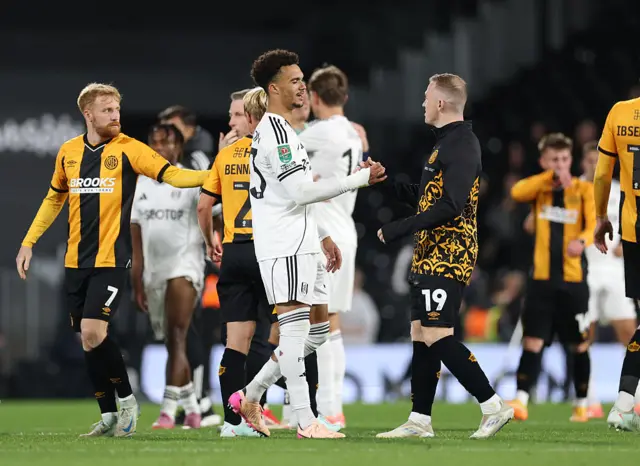 Fulham and Cambridge players shake hands