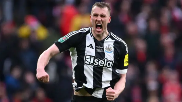 Dan Burn celebrates scoring against Liverpool