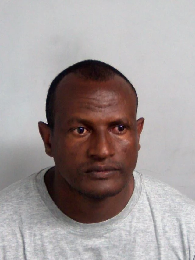 Picture of a man wearing a grey shirt. The man pictured is Kebatu.