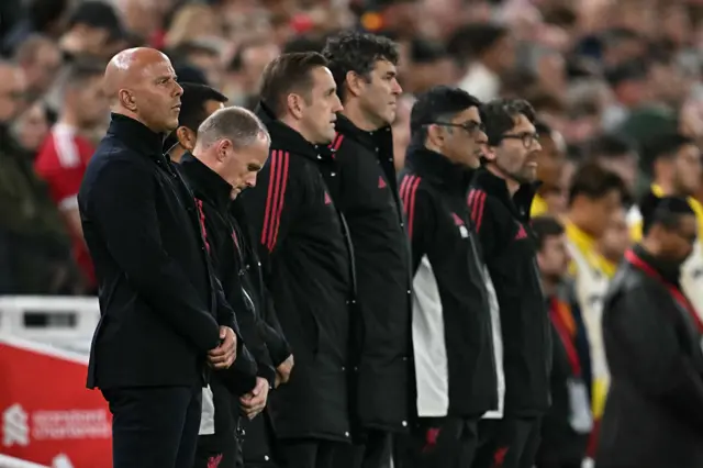 Slot and his staff observe the minute's silence