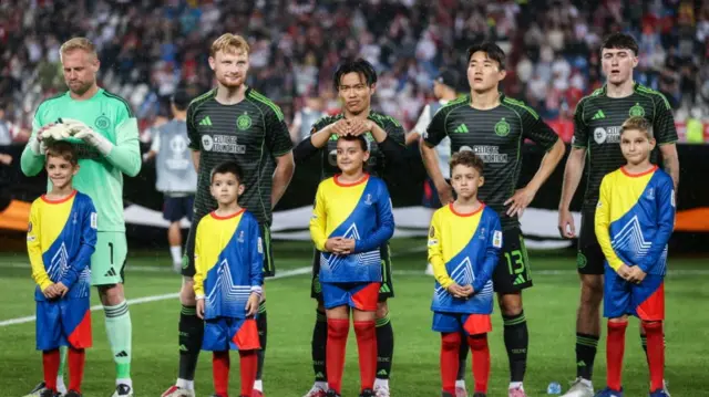 Celtic players and mascots