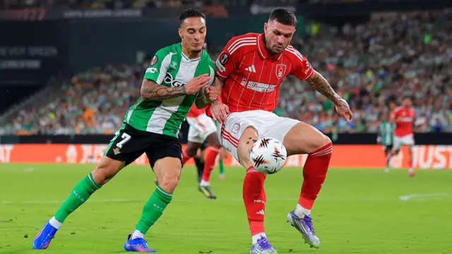 Antony and Morato compete for the ball