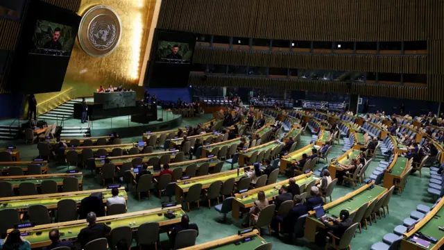 The UN hall looks on as Zelensky speaks