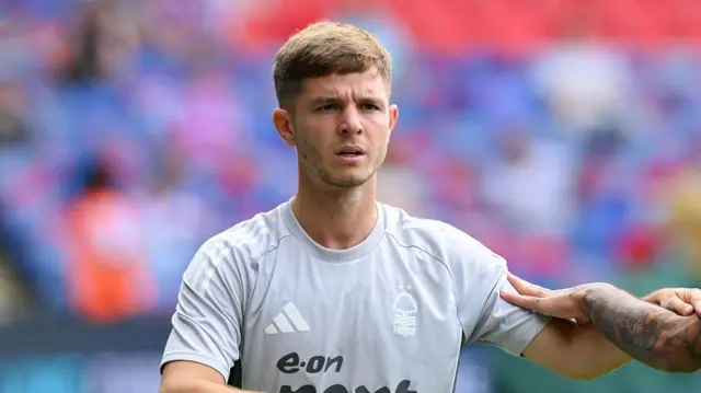 James Macatee warms up with Nottingham Forest