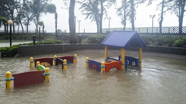 A playground partially submerged in floodwaters