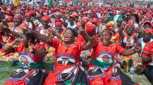 Malawi Congress Party (MCP) supporters dance during MCP's final campaign rally at Civo Stadium in Lilongwe, on September 13, 2025