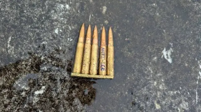 Bullet casings with engraved anti ice written on the top of them