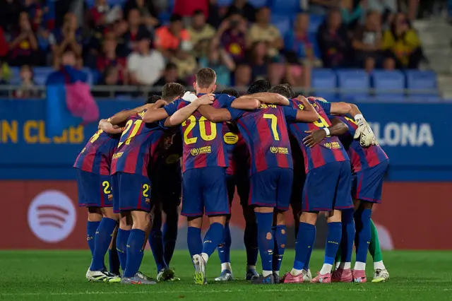 Barcelona team in a huddle