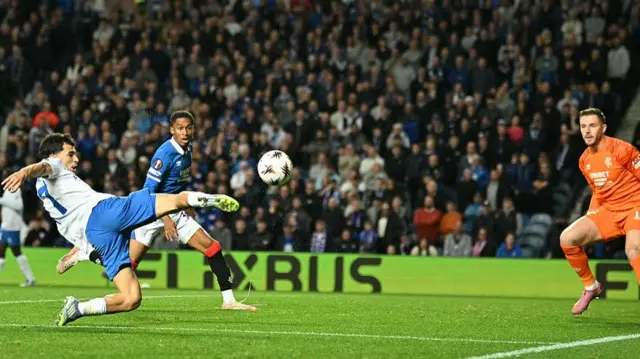 KRC Genk's Moroccan defender #77 Zakaria El Ouahdi shoots but fails to score during the UEFA Europa League, league stage football match between Rangers and Genk at the Ibrox Stadium