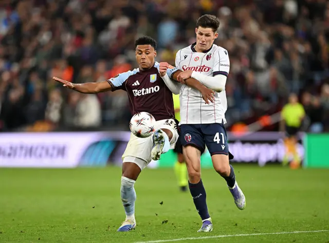 Ollie Watkins of Aston Villa is challenged by Martin Vitik of Bologna FC 1909