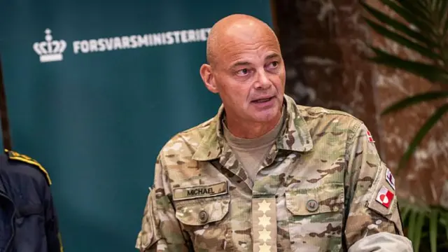 Denmark's Chief of Defence Michael Hyldgaard in uniform answers questions during a press conference