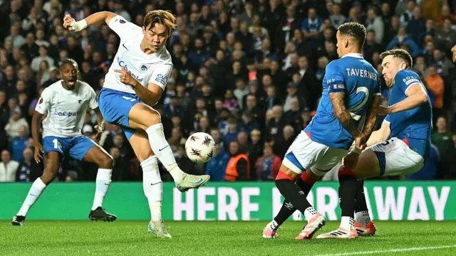 KRC Genk's South Korean striker #09 Hyeon-Gyu Oh shoots at goal during the UEFA Europa League, league stage football match between Rangers and Genk at the Ibrox Stadium in Glasgow