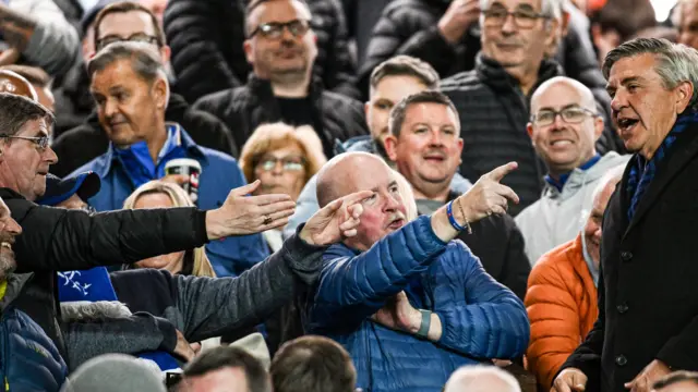 Rangers chairman Andrew Cavenagh shakes the hand of a Rangers fan during a UEFA Europa League match between Rangers and KRC Genk at Ibrox Stadium