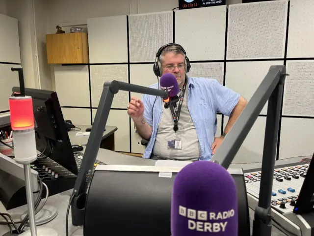 Ian Skye speaking in a radio studio