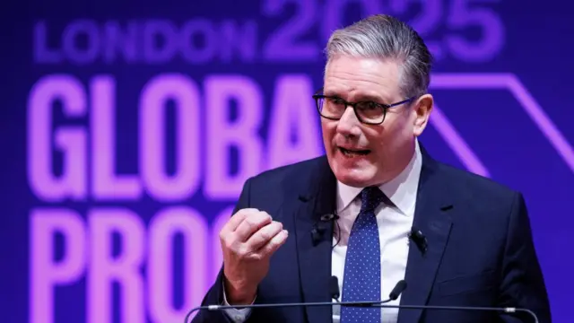 Starmer speaking at a podium