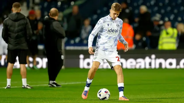 Isaac Price controls the ball while warming up