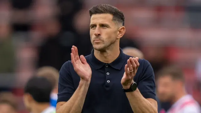 Portsmouth boss John Mousinho applauding away fans