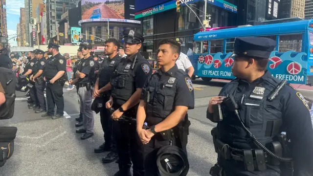 A line of New York Police officers separate protestors from the UN building