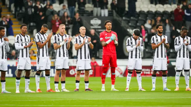 St Mirren players observe a minute's applause for former player and manager Jimmy Bone