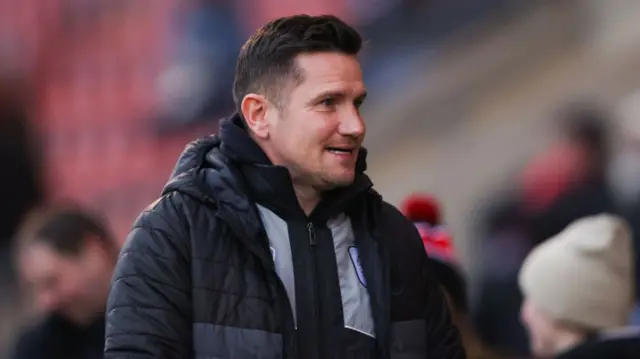 Crewe manager Lee Bell at a football match