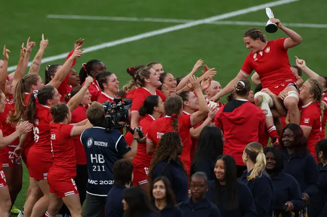 Canada's lock Sophie de Goede receives the player of the tournament trophy