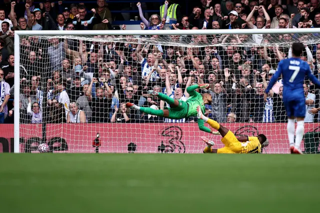 Brighton's English striker #18 Danny Welbeck scores the equalising goal