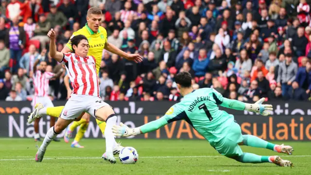 Bae Jun-Ho of Stoke City has his effort cleared off the line by Jakov Medic of Norwich City