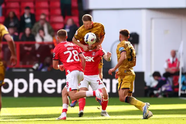 Scott Wharton of Blackburn Rovers competes for the ball with Charlie Kelman of Charlton Athletic