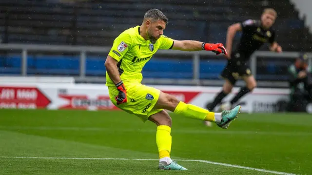 Gillingham keeper Glenn Morris kicks the ball