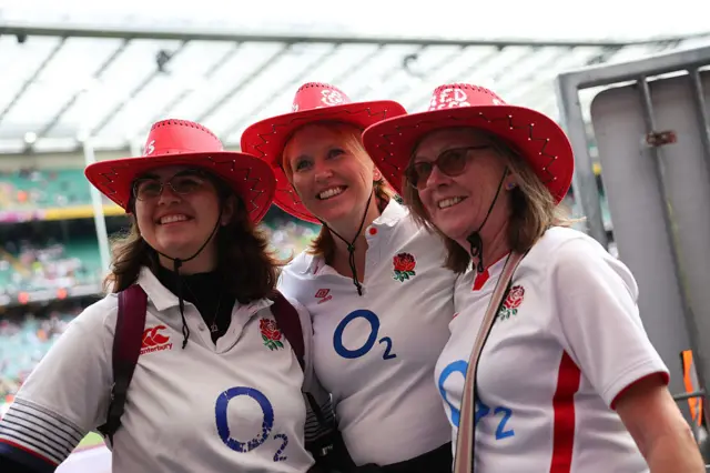 A picture of England fans with england shirts