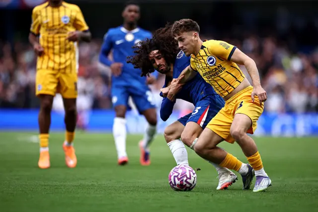 Chelsea's Spanish defender #03 Marc Cucurella battles for the ball with Brighton's German midfielder #08 Brajan Gruda
