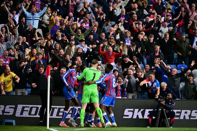 Eddie Nketiah celebrates with teammates after scoring their late winner