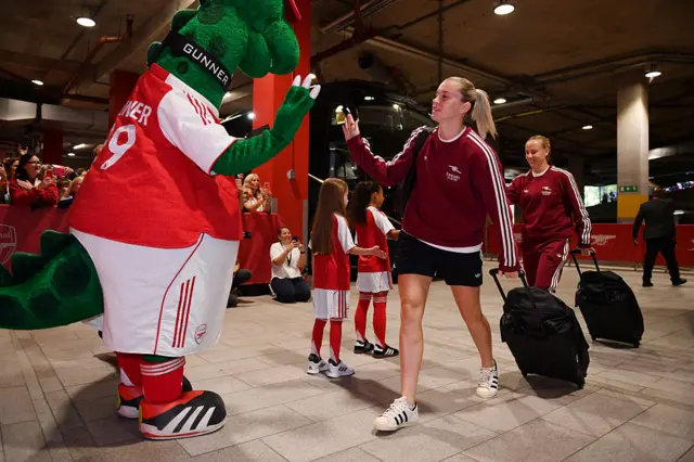 Alessia Russo of Arsenal interacts with Gunnersaurus, mascot of Arsenal, as she arrives at the stadium prior to the Barclays Women's Super League match between Arsenal and Aston Villa at Emirates Stadium on September 27, 2025 in London, England.