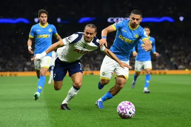 Tottenham Hotspur's Xavi Simons in action with Wolverhampton Wanderers' Andre