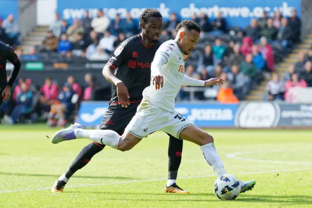 Derek Mazou-Sacko of Millwall chases Ronald of Swansea City