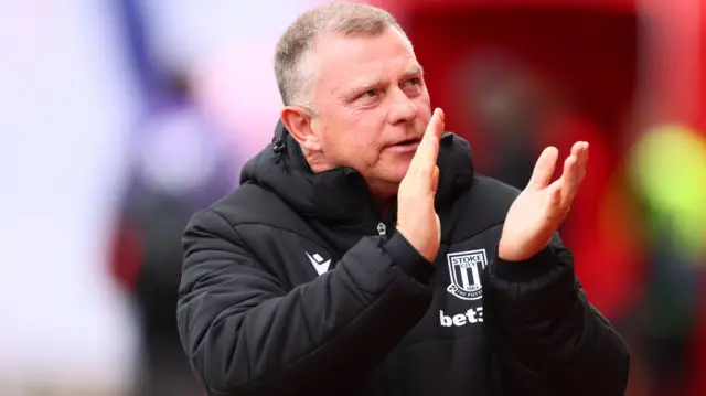 Mark Robins applauds