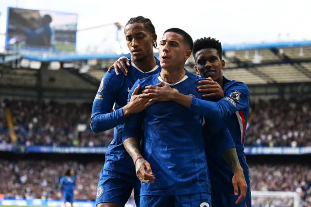 Enzo Fernandez of Chelsea celebrates scoring his team's first goal with teammates Joao Pedro (L) and Estevao (R)during the Premier League match between Chelsea and Brighton & Hove Albion at Stamford Bridge on September 27, 2025 in London, England.