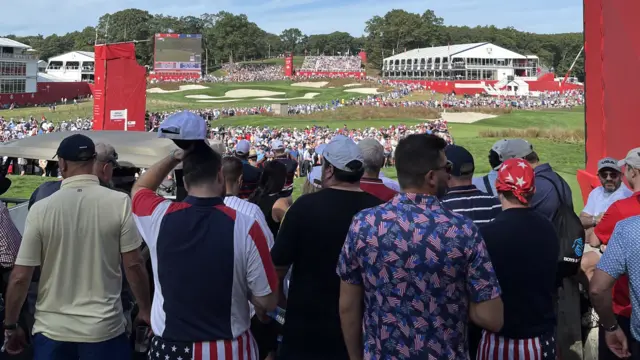 An image of supporters at the 15th tee
