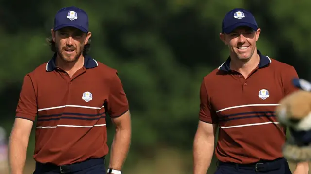 Tommy Fleetwood and Rory McIlroy walking