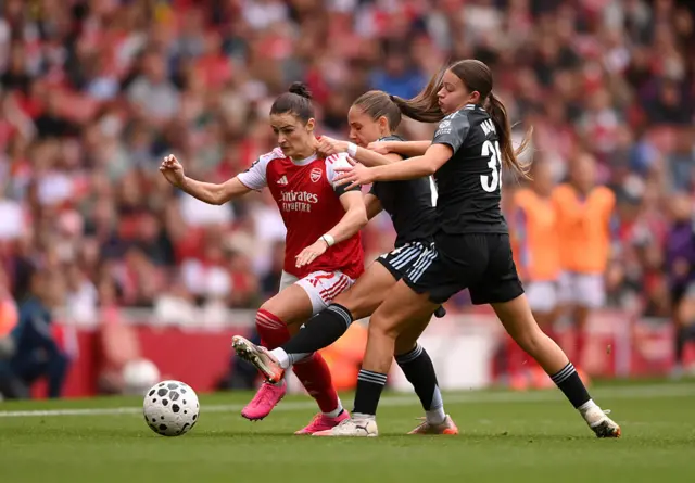 Emily Fox of Arsenal is challenged
