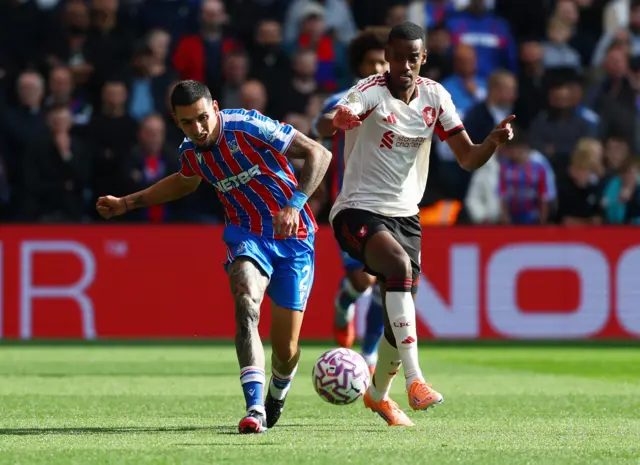 Crystal Palace's Daniel Munoz in action with Liverpool's Alexander Isak