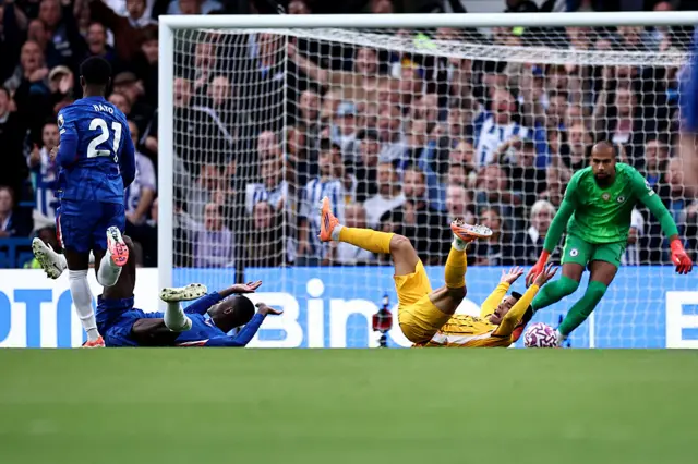 Chelsea's English defender #23 Trevoh Chalobah falls to the floor