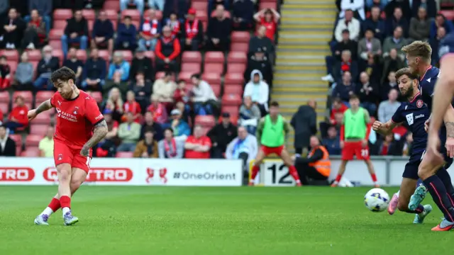 Aaron Connolly shoots the ball to score