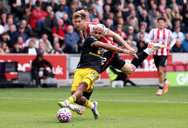 Nathan Collins of Brentford fouls Bryan Mbeumo