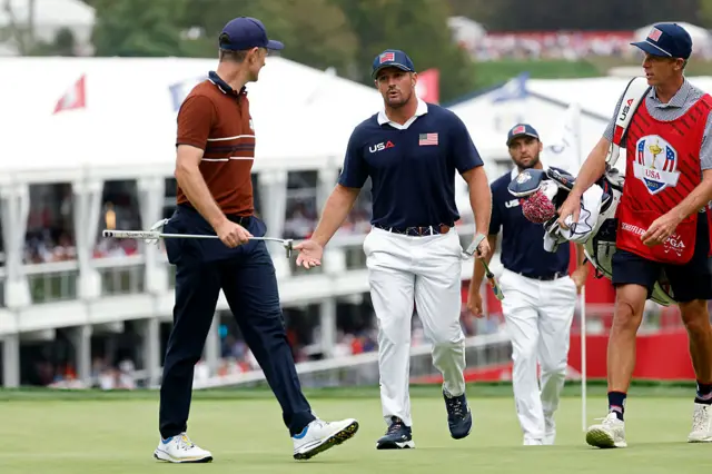 Justin Rose exchanges words with Bryson DeChambeau