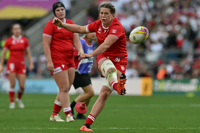Canada's lock Sophie de Goede kicks a penalty