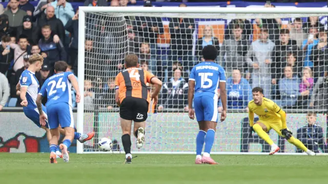 Michael Mellon (far left) kicks a penalty to score