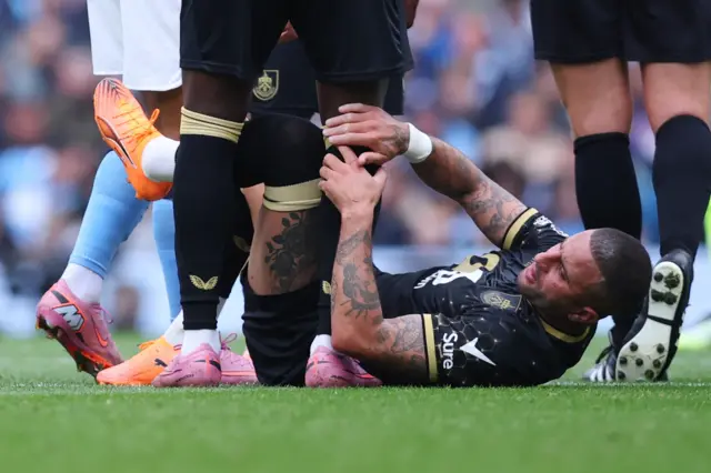 Burnley's Kyle Walker reacts after sustaining an injury